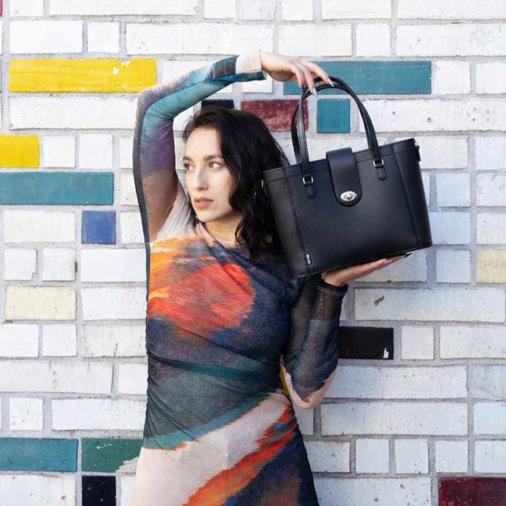Zatchels Mini Twist Lock Leather Shopper in Black, shown worn by a model
