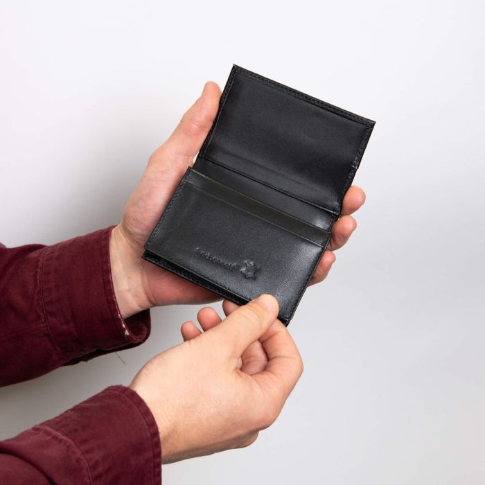 Fred Bennett black leather card holder with contrasting red stitching; product photograph 3
