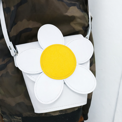 Zatchels Daisy Leather Barrel Bag in White, shown worn by a model